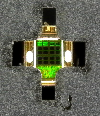 OPT4001-Q1 Image of
                    FPCB With OPT4001-Q1 Mounted, Receiving Light Through
                    the Cutout With a Plus Shape