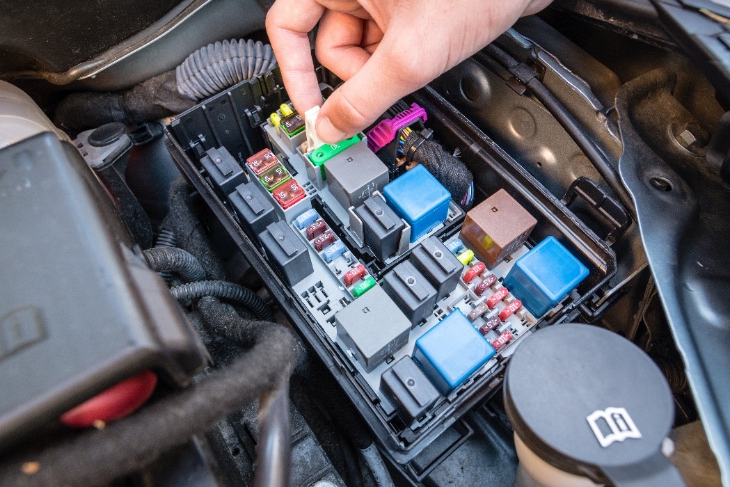  A typical power distribution box with
          melting fuses and mechanical relays.