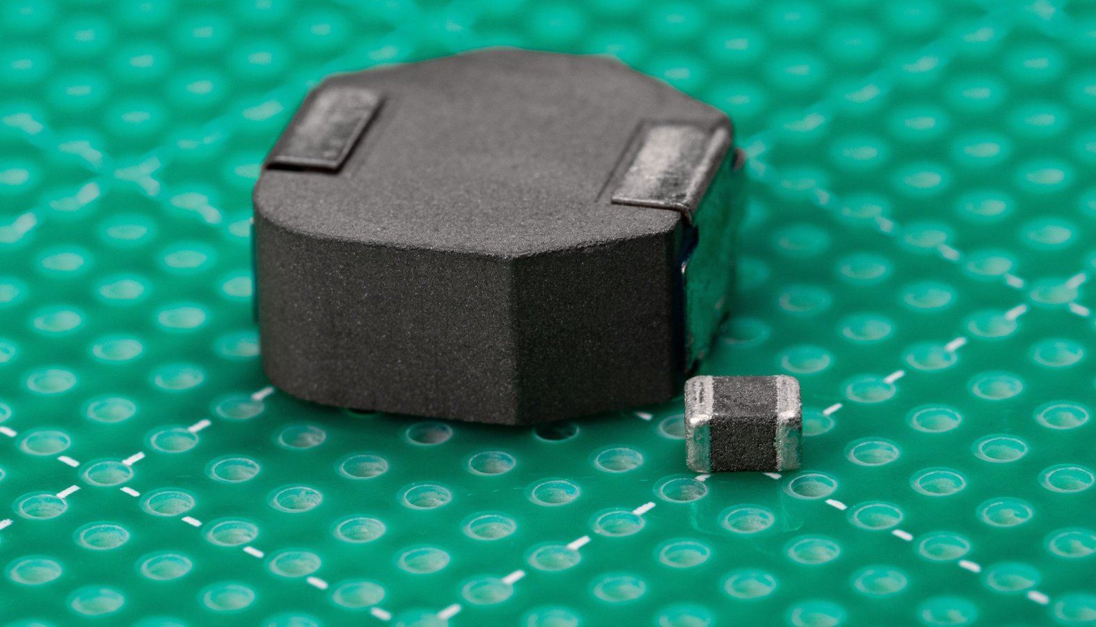  Size comparison of an 8.2µH
                    inductor (400kHz) and a tiny 3.3µH inductor (2.1MHz)